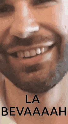a close up of a man 's face with the words la bevaaaah on the bottom .
