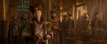 a group of men are dressed in medieval costumes