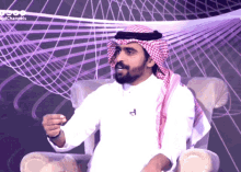 a man sitting in a chair with a purple background and the word channels on the bottom