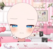 a bald head with blue eyes is sitting at a table