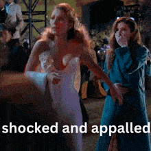 a woman in a white dress is standing next to another woman in a blue coat with the words shocked and appalled below them