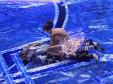 a man and a woman are laying on top of each other on a blue surface in a video game .