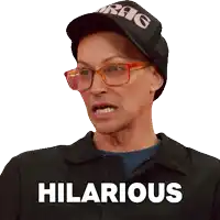 a man wearing glasses and a hat has hilarious written on his shirt