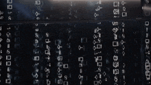 a black background with a lot of letters and numbers on it