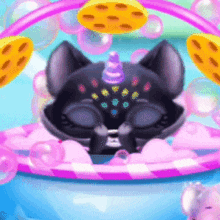 a black cat with a unicorn horn is in a bowl of bubbles