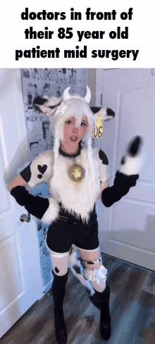 a woman in a cow costume is standing in front of a door ..