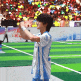 a man in a blue and white shirt with the number 2 on it