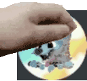 a hand is holding a cd with a picture of a cartoon character on it .