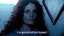 a woman with curly hair says " i 'm gonna kill the fucker "