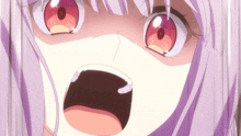 a close up of a girl 's face with her mouth wide open