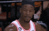 a basketball player wearing a headband with the number 8 on it