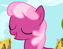 a pink pony with green eyes and a pink mane