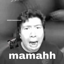 a black and white photo of a man with the word mamahh written on it