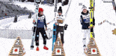 three skiers are standing on a podium with one wearing a number 33 jersey