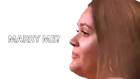 a woman with the words marry me written above her