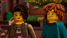 two lego figures are standing next to each other and one has a sad face