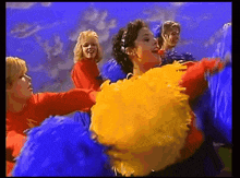 a group of cheerleaders are dancing in a video