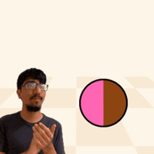 a man wearing glasses is clapping in front of a sign that says duplicator + slammy duplislam