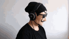 a man wearing headphones and sunglasses with the letter g on them