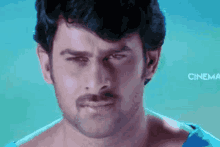 a close up of a man 's face with the word cinema in the background