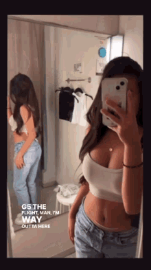 a woman taking a selfie in front of a mirror with the words g5 the flight man