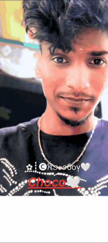 a young man wearing a purple shirt that says choco boy