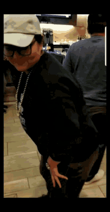 a woman wearing a white hat and a black shirt with the word snoop dogg on the front