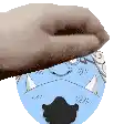 a cartoon character with horns and a mustache is being held by a person 's hand .