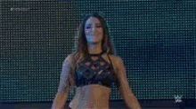 a woman is dancing in front of a sign that says next