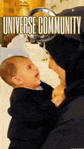 a woman in a hijab is holding a baby with the words universe community written on the bottom