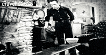 a black and white photo of a man standing in front of a fireplace with the name cravello written on the bottom