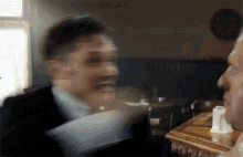 a blurry photo of a man in a suit and tie