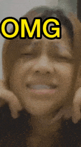 a close up of a woman 's face with the word omg above it