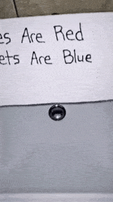 a bathroom sink with a sign that says " toilets are red pets are blue "