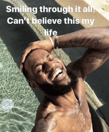 a shirtless man is smiling in front of a pool with the caption smiling through it all can t believe this my life