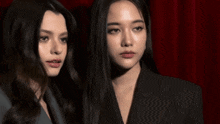 a couple of women standing next to each other