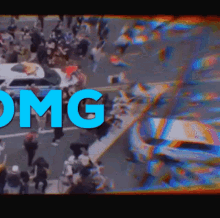 a blurry picture of a crowded street with the word omg written in blue