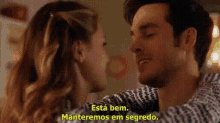 a man and a woman are looking at each other and the woman is saying `` esta bem . manteremos em segredo . ''