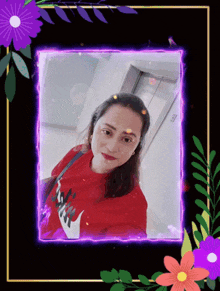 a woman in a red shirt with the word nike on it is surrounded by flowers