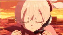 a girl with pink hair is wearing headphones
