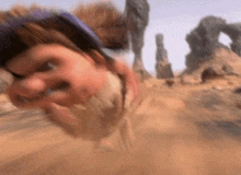 a close up of a person 's face in a desert .