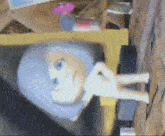 a blurred image of a doll with a blue head