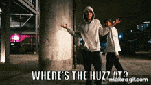 two men are standing next to each other with the words where 's the huzz at written on the bottom