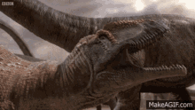 Sauropod Allosaurus GIF - Sauropod Allosaurus Fight GIFs
