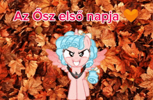 a pink pony is standing in a pile of leaves with the words az osz elso napja written above her