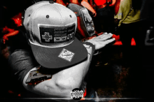 a man wearing a hat that says snapback on the front