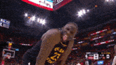 a basketball player wearing a jersey with the number 23 sticking his tongue out