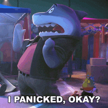 a cartoon character says i panicked okay in front of a shark