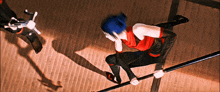 a woman with blue hair is holding a pole in her hands