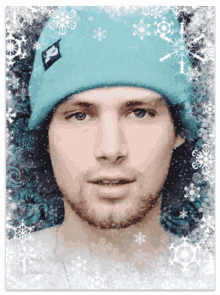 a man wearing a blue beanie with a x on it